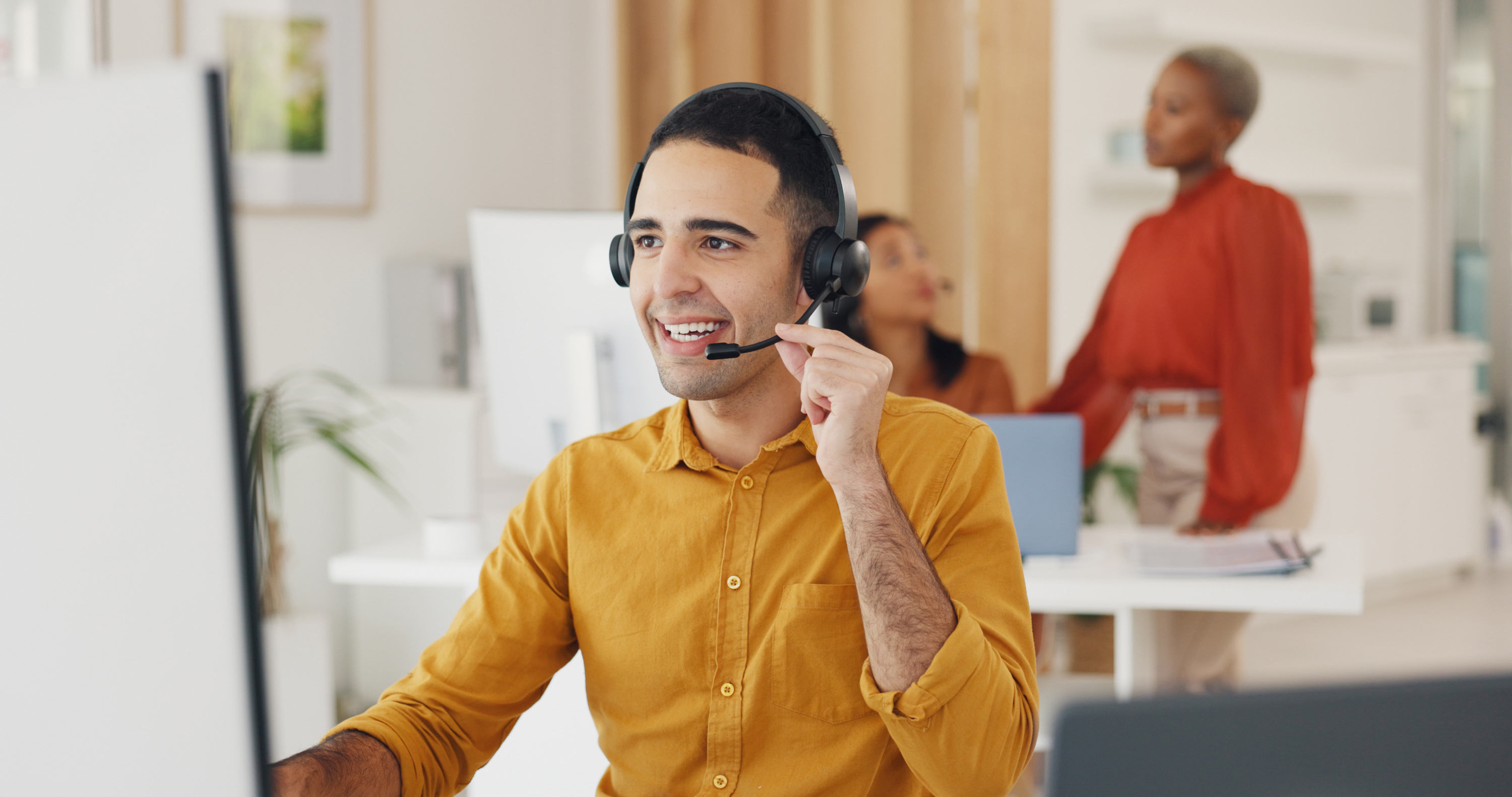 Professional smiling and talking to headset: Strategic partnerships for optimal connectivity