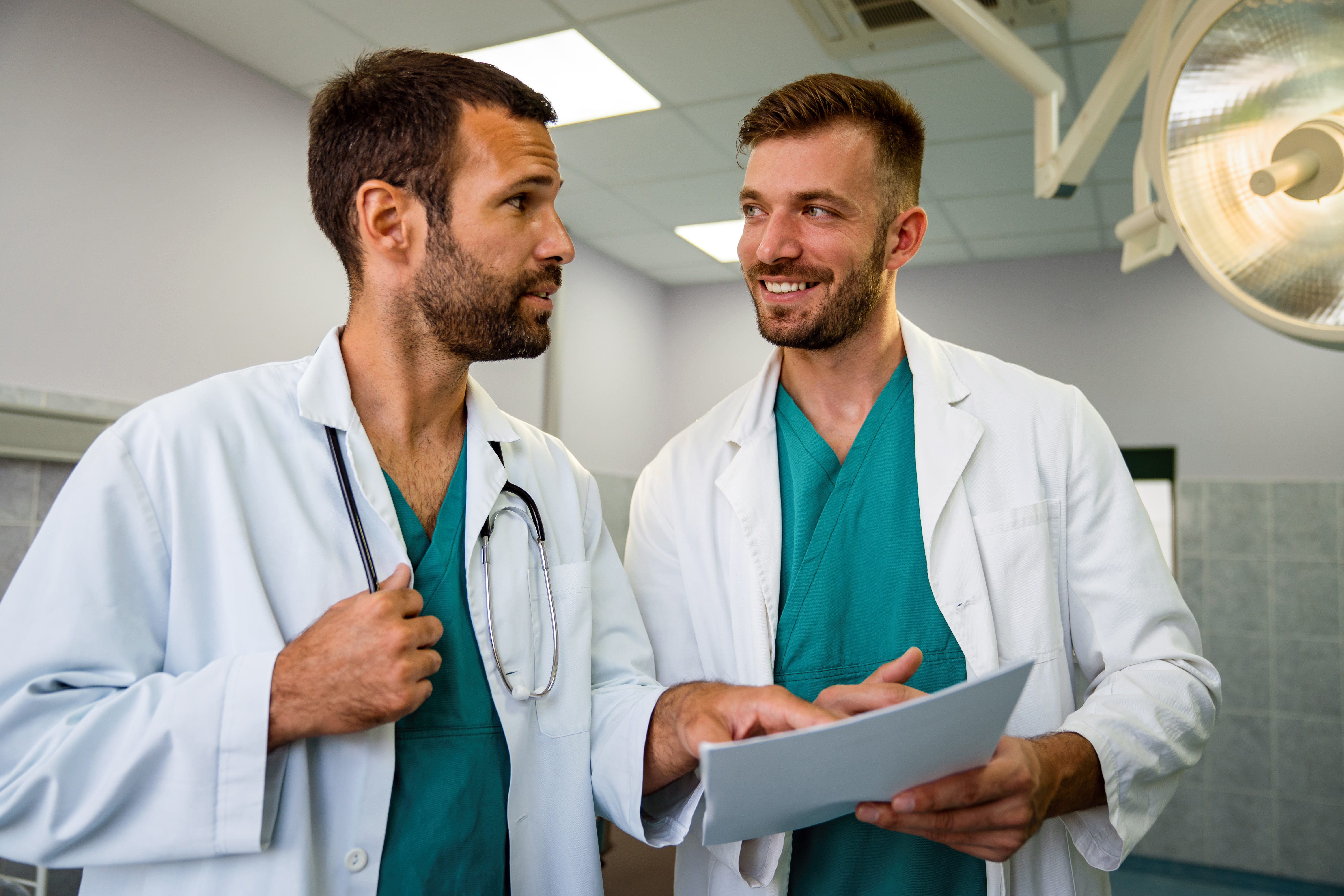 Two doctors discussing about patient records